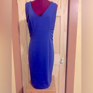 Sleeveless, v-neck dress. Electric blue color with pleated waist detail.